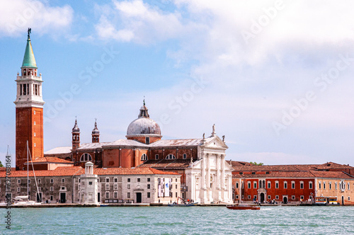 Front view, far distance of, St. Mark's Basilica and other historic buildings, on grand canal, Venice, Italy