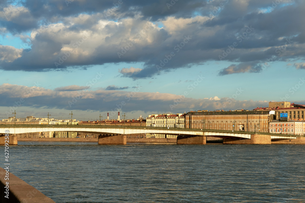 Road bridge across the European city river on a summer day.