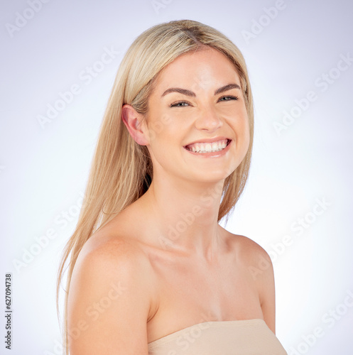 Portrait  blonde and beauty of happy woman with skincare  natural aesthetic and studio background. Face  female model and smile for dermatology  hair care cosmetics or keratin shampoo of healthy glow