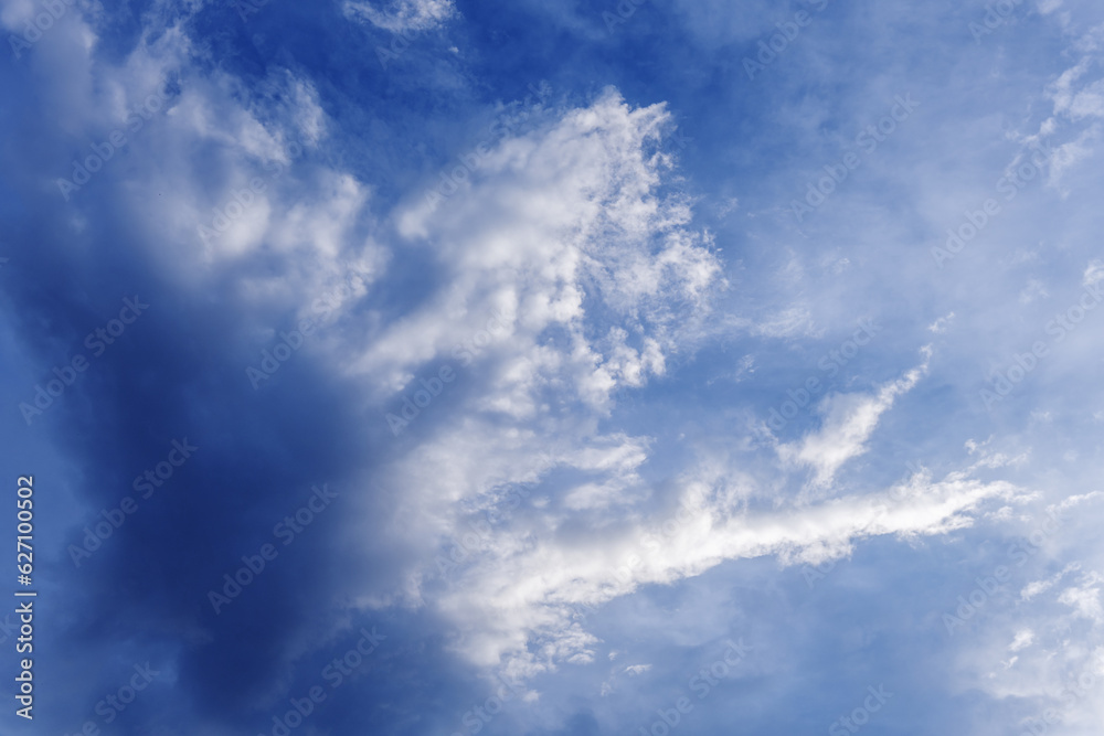 A landscape of the blue sky with clouds loaded with humidity