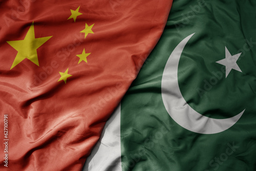 Bild auf Leinwand big waving national colorful flag of china and national flag of pakistan