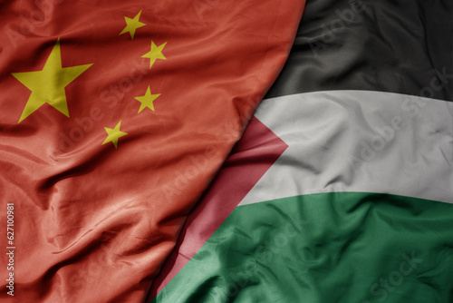 Sticker big waving national colorful flag of china and national flag of palestine
