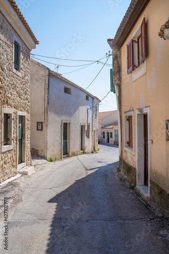 Street with old buildings in Lakones village  Corfu  Greece