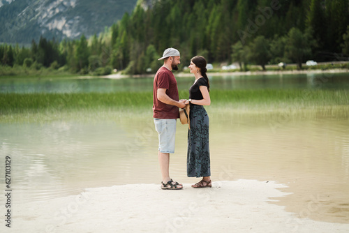 Beautiful traveler in front of lago di landro Italy