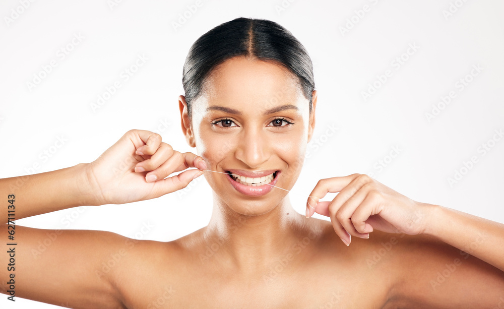Happy woman, portrait and dental floss for teeth or clean hygiene against a white studio background. Female person or model flossing tooth with smile for oral, mouth or gum care on mockup space Happy woman, portrait and dental floss for teeth or clean hygiene against a white studio background. Female person or model flossing tooth with smile for oral, mouth or gum care on mockup space