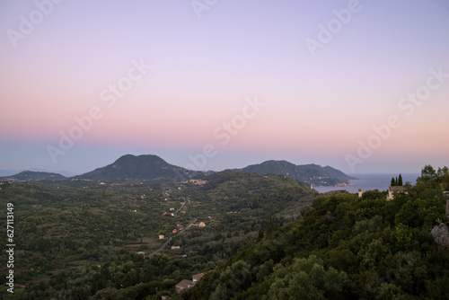 Amazing mountainous view to Corfu from Pelekas village in the dusk © kokixx