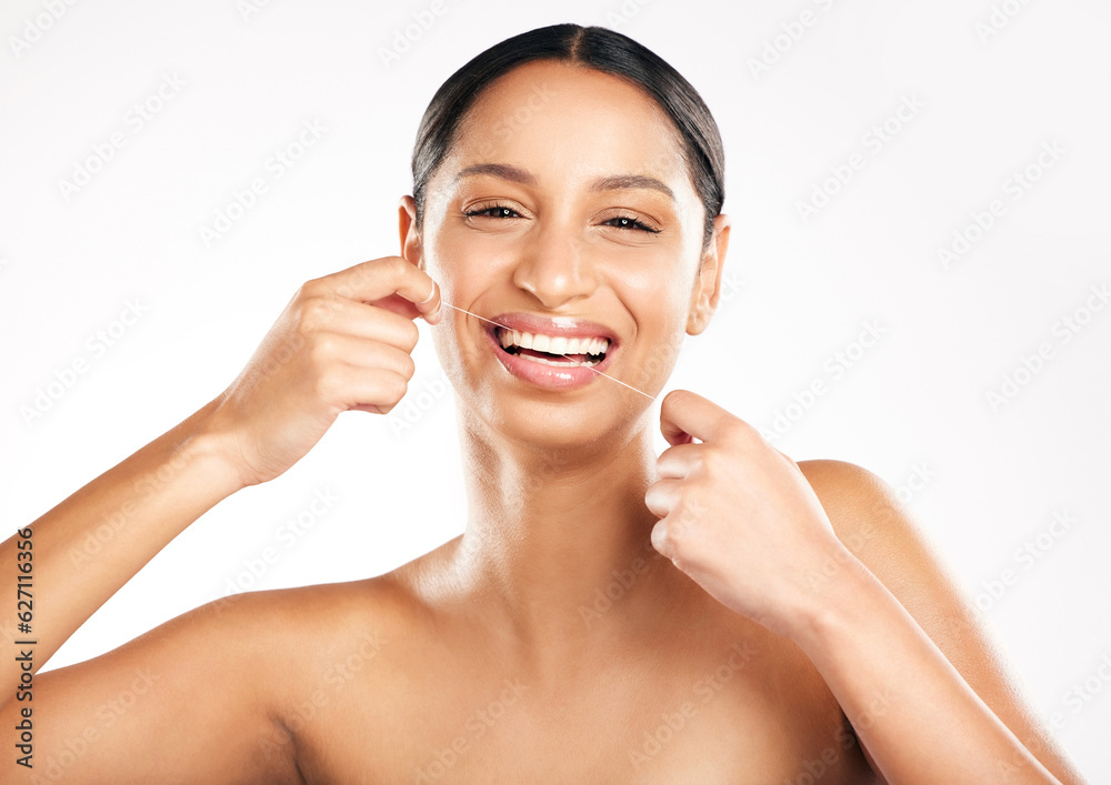 Happy woman, portrait and dental floss for teeth, hygiene or cleaning against a white studio background. Face of female person or model flossing tooth with smile for clean oral, mouth or gum care Happy woman, portrait and dental floss for teeth, hygiene or cleaning against a white studio background. Face of female person or model flossing tooth with smile for clean oral, mouth or gum care