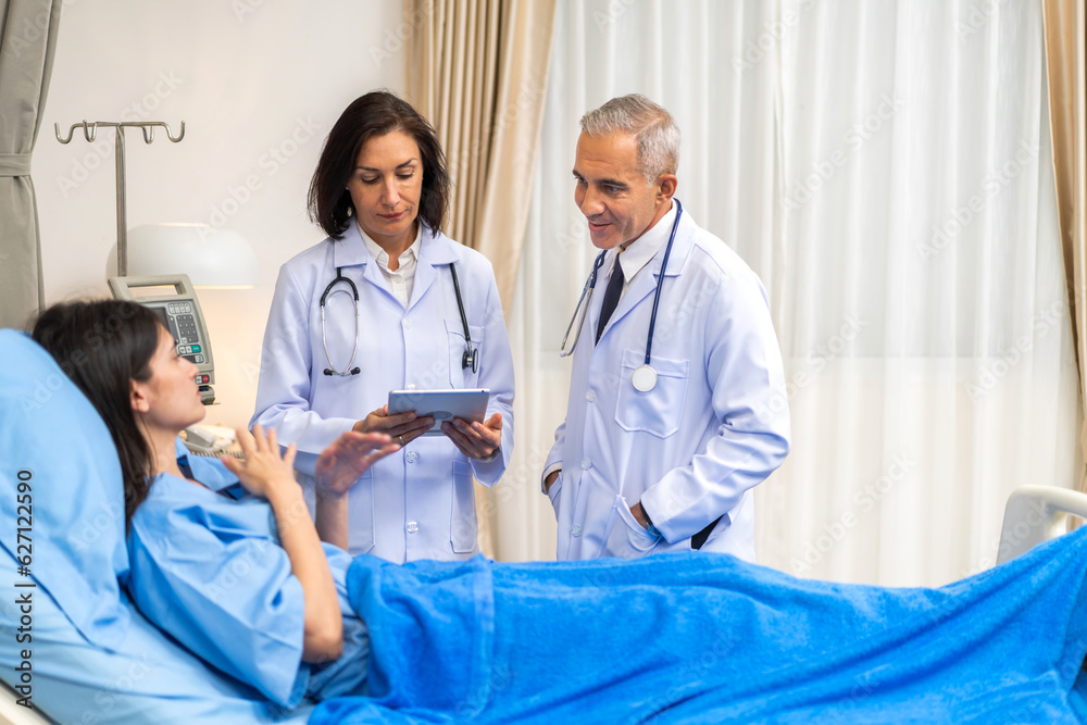 Obraz premium Senior man doctor wearing uniform with stethoscope help discussing and consulting talk to sick woman patient checkup information, support, care, diseases, treatment in hospital.healthcare