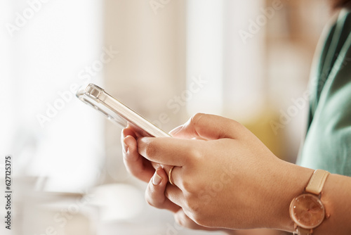 Woman  hands and typing with phone in home  reading social media notification or online contact. Closeup of female person  smartphone and app user download mobile games  search digital network or web