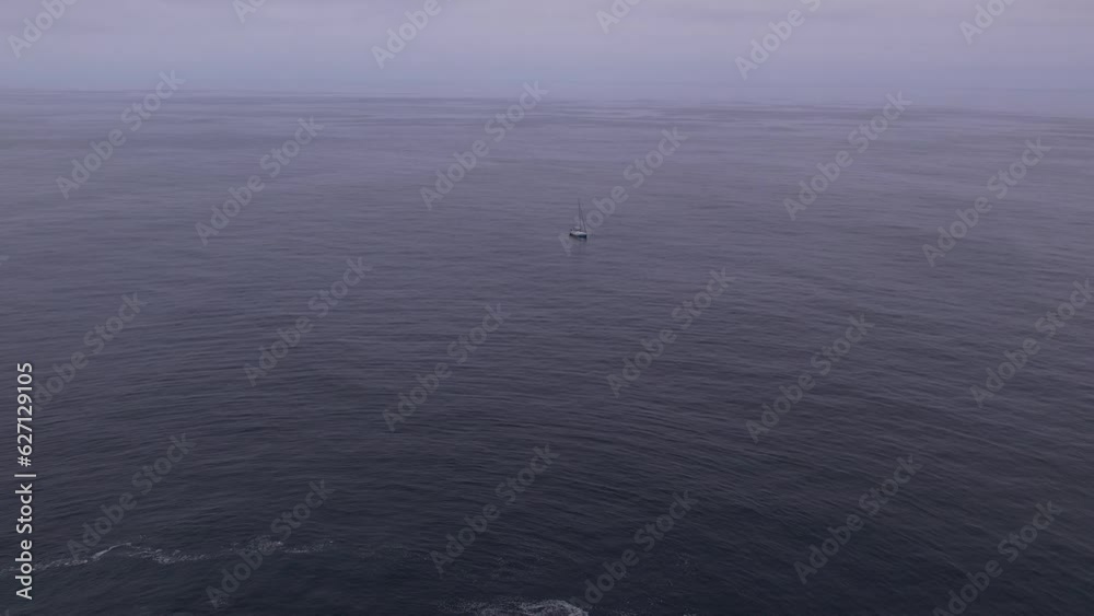 Aerial shot pulling away from a sailboat near Big Sur, California Aerial shot pulling away from a sailboat near Big Sur, California