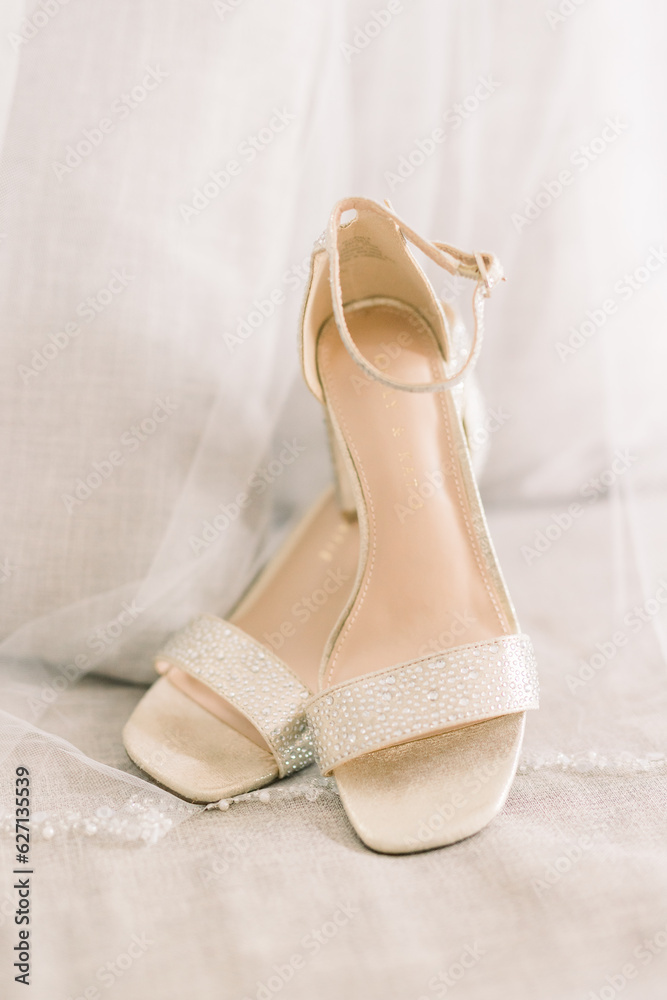 Obraz premium Elegant wedding shoes on a chair. 