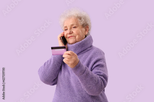Senior woman with credit ca...