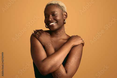 Cheerful black woman in studio