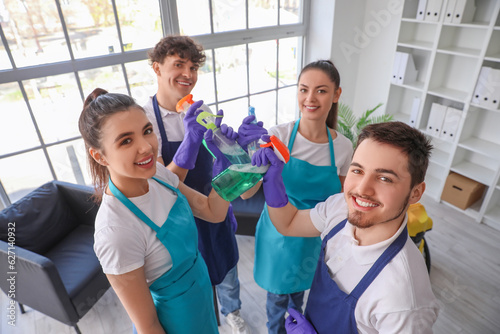 Young janitors with bottles...