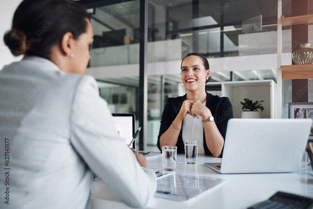 I just love it when were working together. Cropped shot of two attractive young businesswomen working together inside a modern office. I just love it when were working together. Cropped shot of two attractive young businesswomen working together inside a modern office.