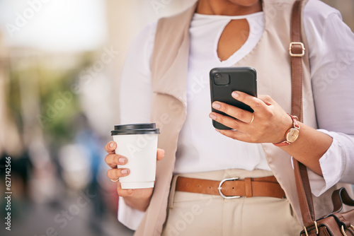 Phone, coffee and hands of person walking and travel in city typing on social media, online or internet. Connection, gps and employee texting a contact via email, web or mobile app in the morning