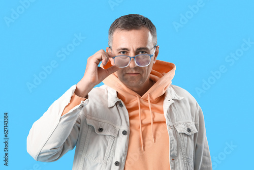 Mature man in eyeglasses on...