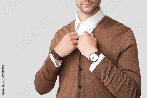 Stylish young man with wris...