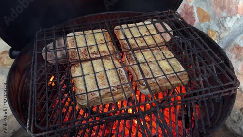 Toasted sandwiches cooking over fire photo