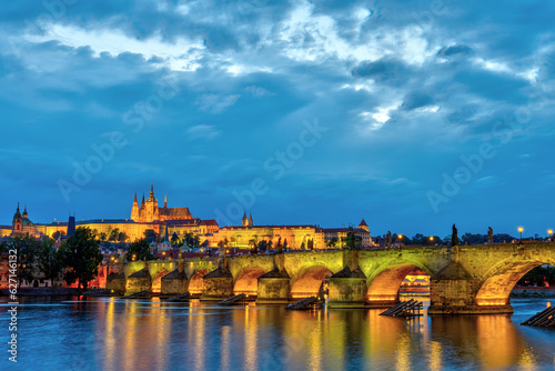 The famous Charles Bridge and the catle in Prague at dawn