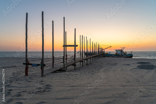 Wooden pier in the wadden sea photo