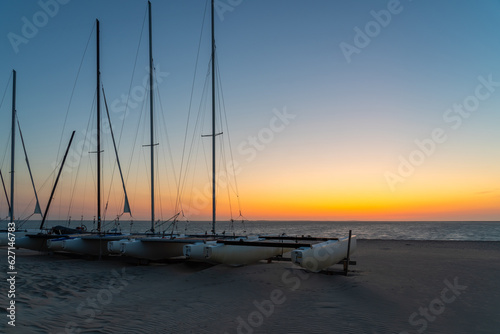 sailboats at sunrise over the sea © denboma