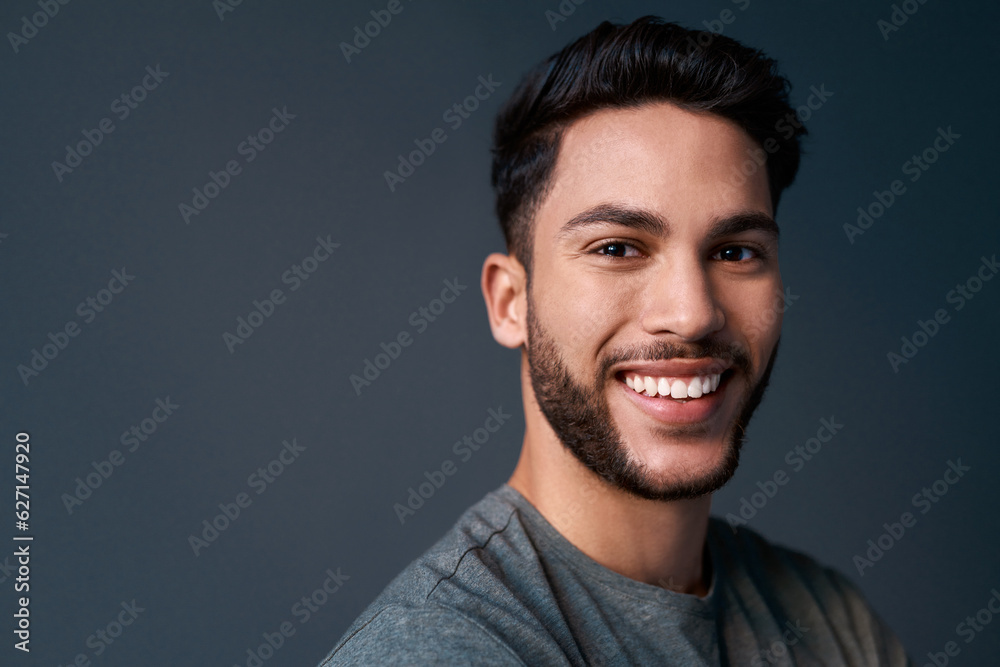 My desire for success is stronger than fear of failure. Cropped portrait of a handsome young businessman standing against a gray background alone in the studio. My desire for success is stronger than fear of failure. Cropped portrait of a handsome young businessman standing against a gray background alone in the studio.