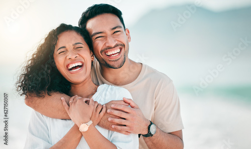 Love, happy and funny with couple on beach for travel, summer and vacation. Peace, smile and relax with portrait of man and woman hugging on date for seaside holiday, care and mockup space