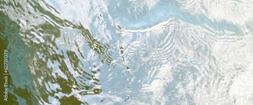 Blurred ripple water texture on white background, white water with ripples on the surface, water waves with shining pattern texture background.