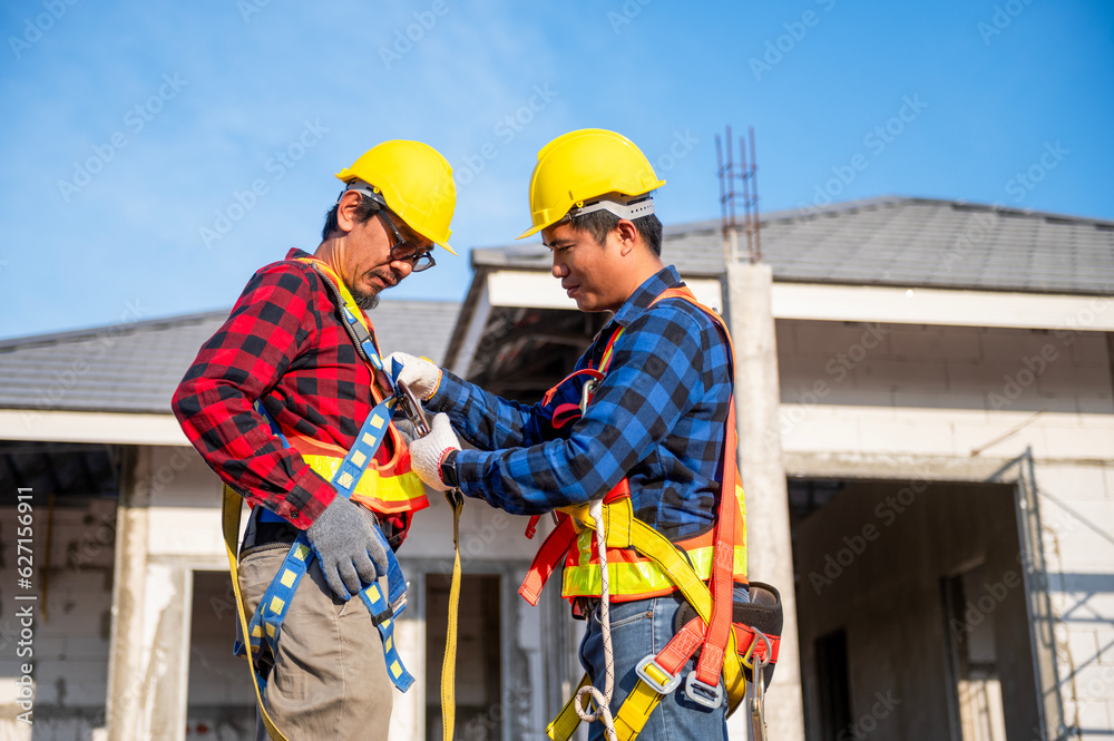 Construction worker preparing safety in work clothes Before installing new roofing tools Roofing tools, electric drills and used on new wooden roofs with metal sheets Construction worker preparing safety in work clothes Before installing new roofing tools Roofing tools, electric drills and used on new wooden roofs with metal sheets
