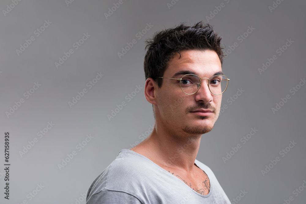 Short-sleeved shirt, chest tattoo visible Short-sleeved shirt, chest tattoo visible