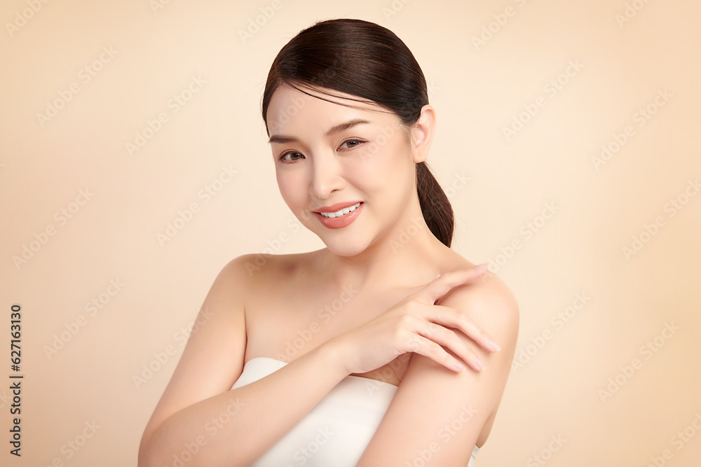 Beautiful young asian woman with clean fresh skin on beige background, Face care, Facial treatment, Cosmetology, beauty and spa, Asian women portrait. Beautiful young asian woman with clean fresh skin on beige background, Face care, Facial treatment, Cosmetology, beauty and spa, Asian women portrait.