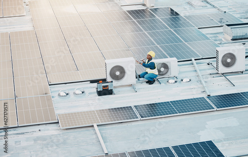 Engineer woman, speaker call and phone in construction, solar energy and maintenance for air conditioner on rooftop. Technician, photovoltaic tech and hvac on roof, building and electricity in city