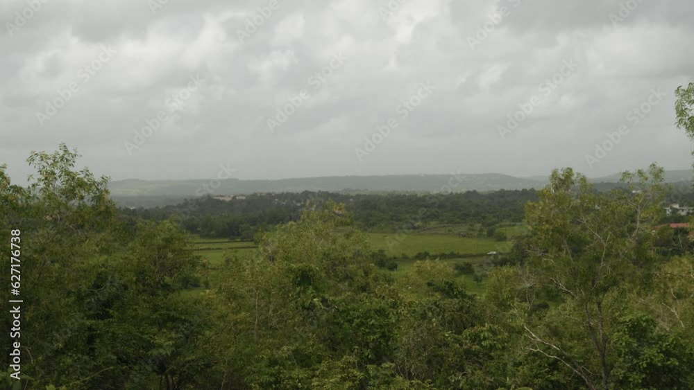 Experience the natural beauty of nature as the clouds flow through a dense forest and the wind stirs the lush vegetation and a huge river in the distance creates an awe-inspiring view. Experience the natural beauty of nature as the clouds flow through a dense forest and the wind stirs the lush vegetation and a huge river in the distance creates an awe-inspiring view.
