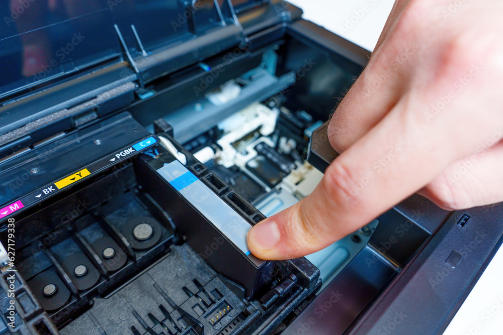 Inserting a New Ink Cartridge into an Inkjet Printer Inserting a New Ink Cartridge into an Inkjet Printer