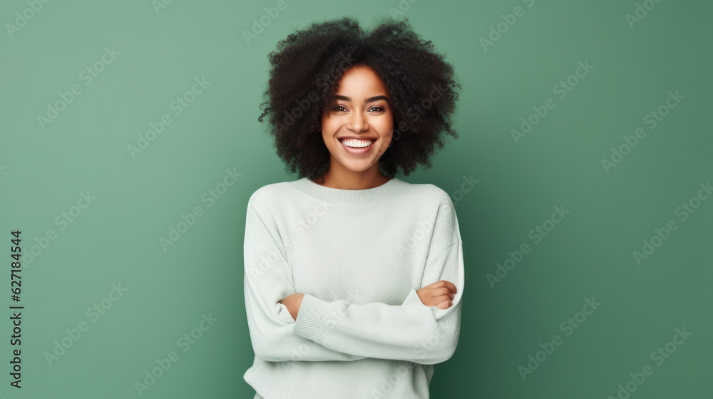 Portrait of a smiling young african woman wearing sweater standing isolated over green background Portrait of a smiling young african woman wearing sweater standing isolated over green background