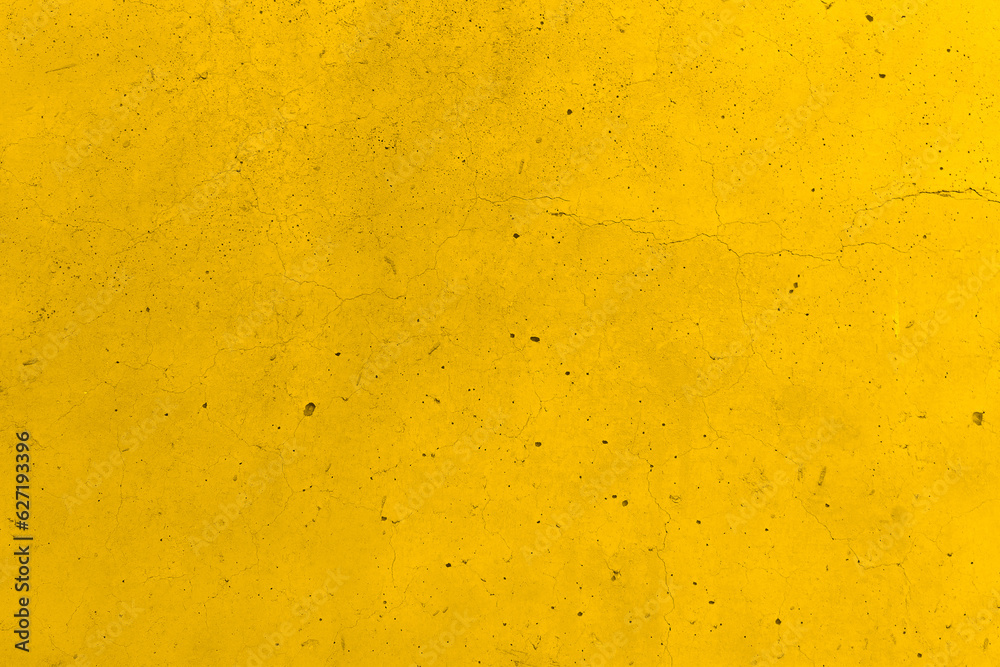 Dirty old cracked yellow concrete wall texture background.  Grunge and rough texture.  Vintage style of the wall. 