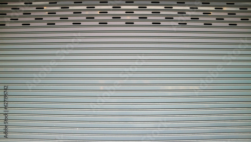 Bild auf Leinwand close up of a roller shutter door in a shop for background use