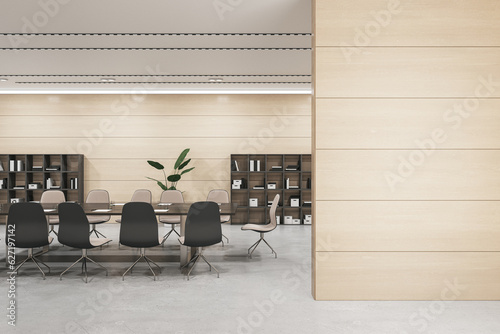 Fototapeta Naklejka Na Ścianę i Meble -  Front view of blank wooden wall with empty place for poster or frame and modern negotiant office room on a background, mockup. 3D Rendering