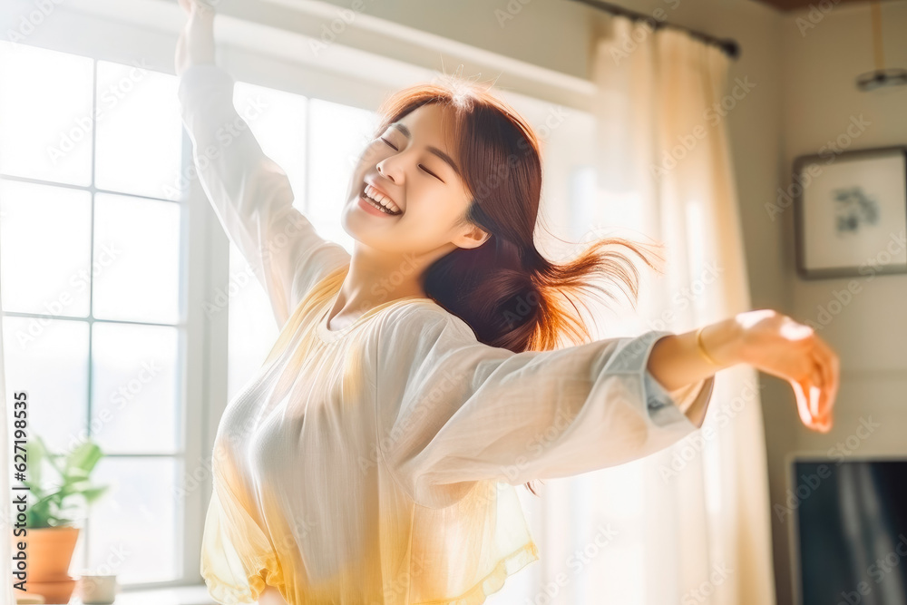 Positive chinese asian teen girl dancing at home. Happiness and well being concept. Positive chinese asian teen girl dancing at home. Happiness and well being concept.