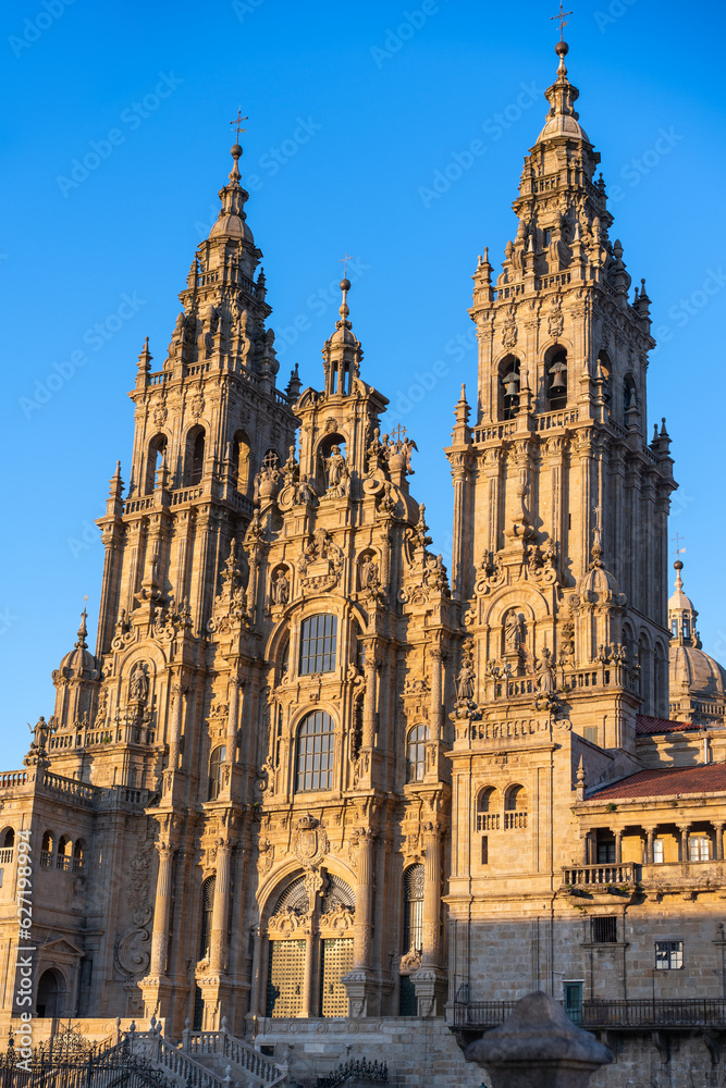 sunrise light illuminating the facade of the cathedral of Santiguo de Compostela, Spain