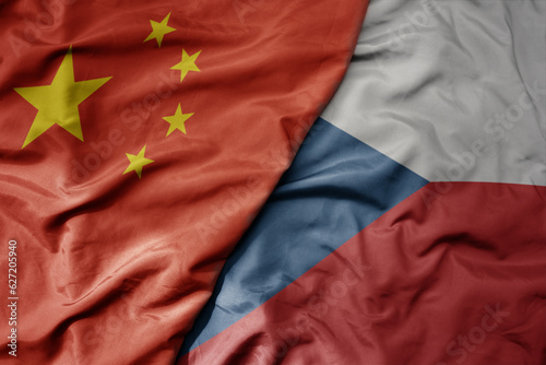 big waving national colorful flag of china and national flag of czech republic .