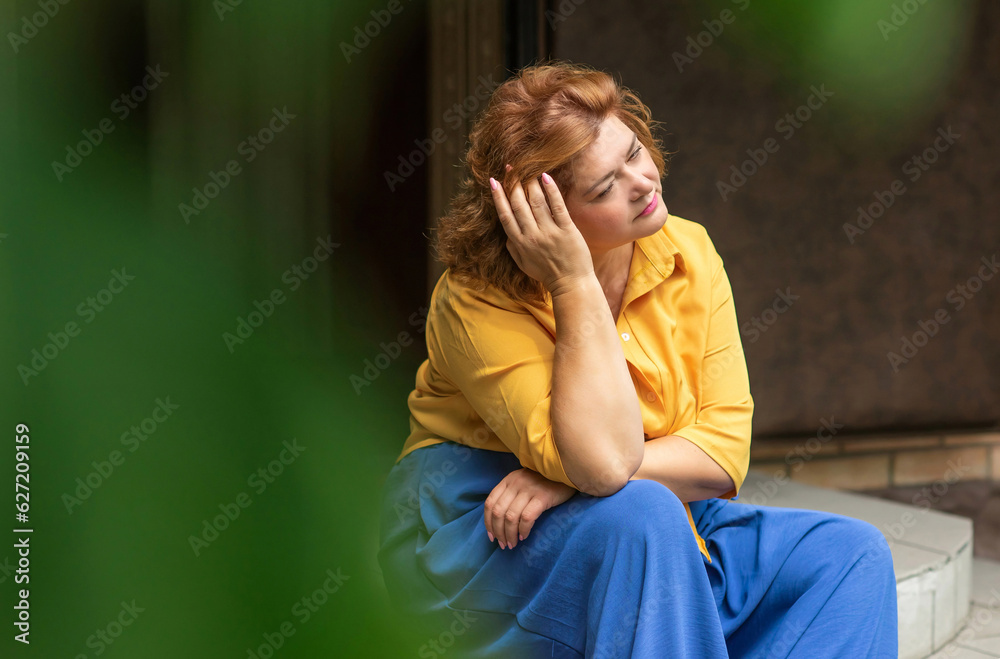Sad plump middle aged woman thinking about something, crisis of middle age and problems among overweight people Sad plump middle aged woman thinking about something, crisis of middle age and problems among overweight people
