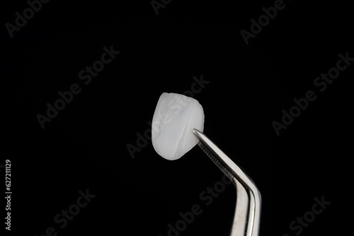 Canvas Print Ceramic Veneer Dental Smile design White teeth Close-up super thin porcelain laminated veneer measurement with a vernier caliper to show the thickness or smile makeover treatment