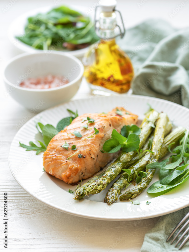 Baked Delicious salmon, green asparagus on  plate