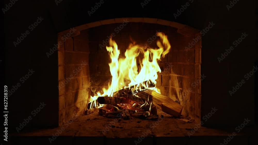 Warm Cozy Fireplace with Real Wood Burning in it. Cozy Winter Concept. Slow Motion. A Looping Clip of a Fireplace with Medium Size Flames. UHD TV screen saver. Video for meditation Warm Cozy Fireplace with Real Wood Burning in it. Cozy Winter Concept. Slow Motion. A Looping Clip of a Fireplace with Medium Size Flames. UHD TV screen saver. Video for meditation