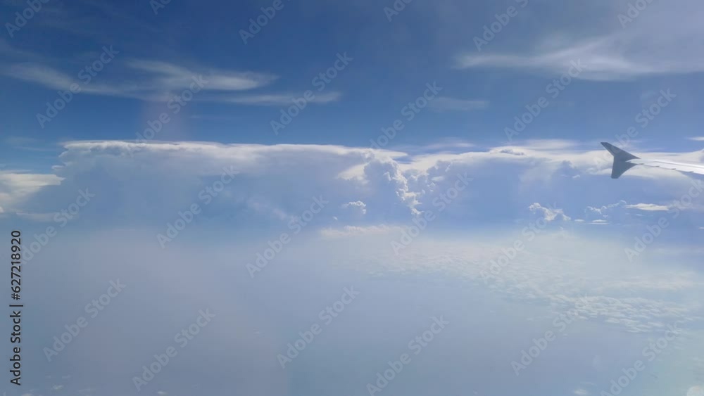 View from the plane window in flight to clouds and sky. View from the plane window in flight to clouds and sky.