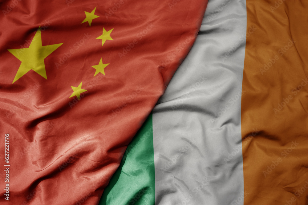big waving national colorful flag of china and national flag of ireland . big waving national colorful flag of china and national flag of ireland .