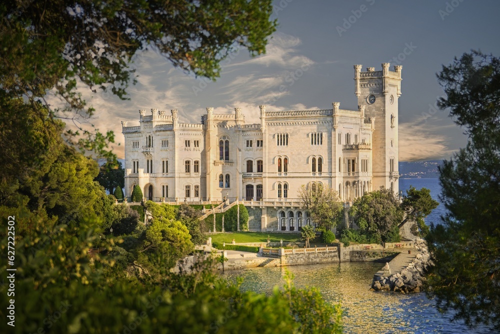 Miramare, Trieste, Italy. The White Marble Stone Castle of Miramare at Sunset