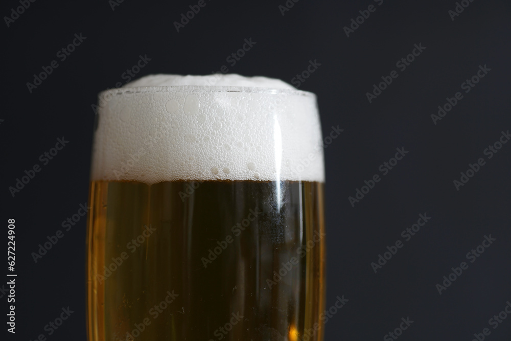 Beer with foam for drinking photographed in studio Beer with foam for drinking photographed in studio